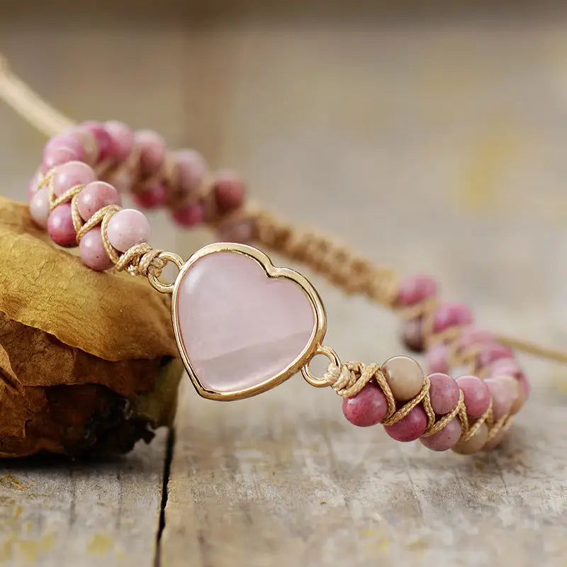 Rose Quartz heart charm bracelet with a shimmering gold-tone chain
