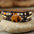 Tiger Eye stone centered on a brown leather wrap bracelet