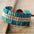 Close-up of a turquoise antique bracelet with braided leather and silver embellishments